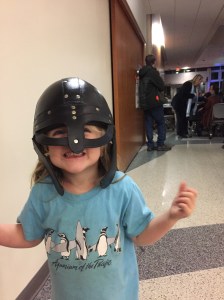 small girl wearing viking helm